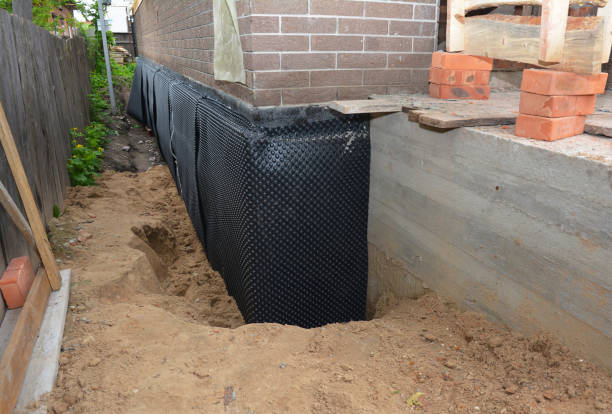 Happy homeowners after waterproofing job in Adamstown
